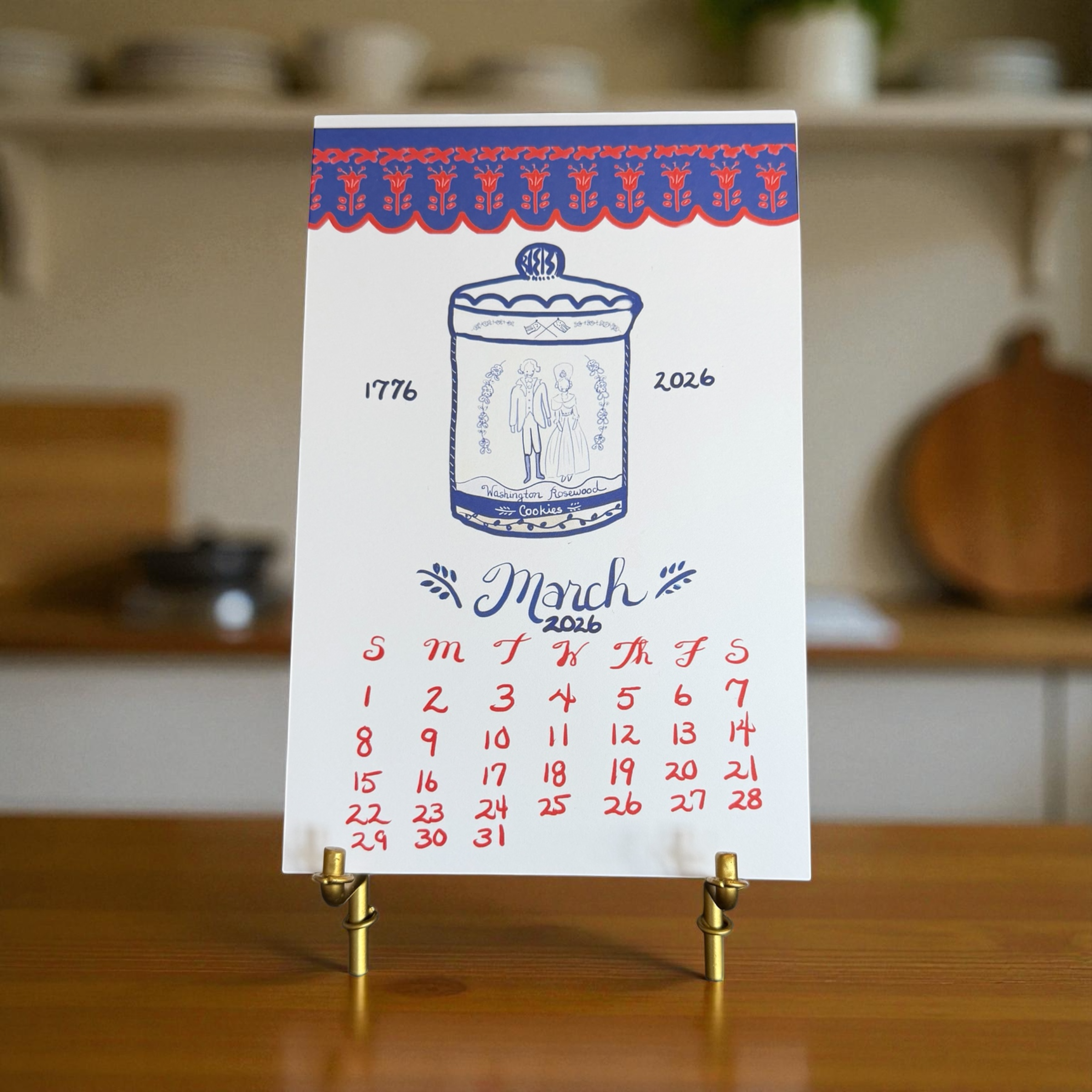 Calendar card with a decorative design on a stand in a kitchen setting